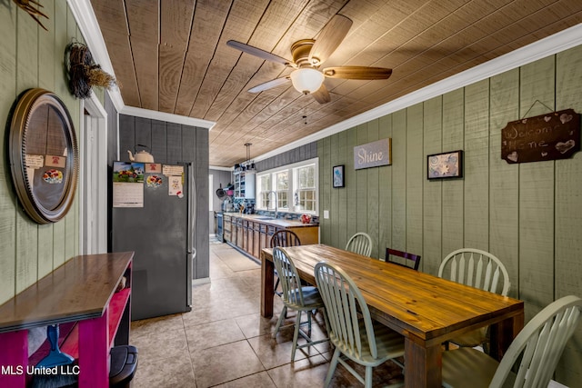 dining area featuring light tile patterned floors, a ceiling fan, ornamental molding, and wooden ceiling