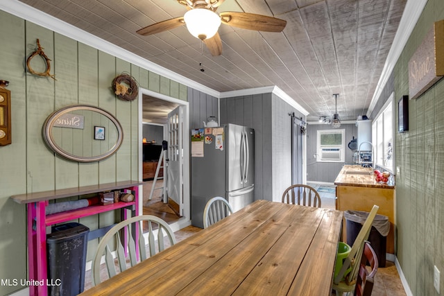 dining room featuring cooling unit, baseboards, ceiling fan, and ornamental molding