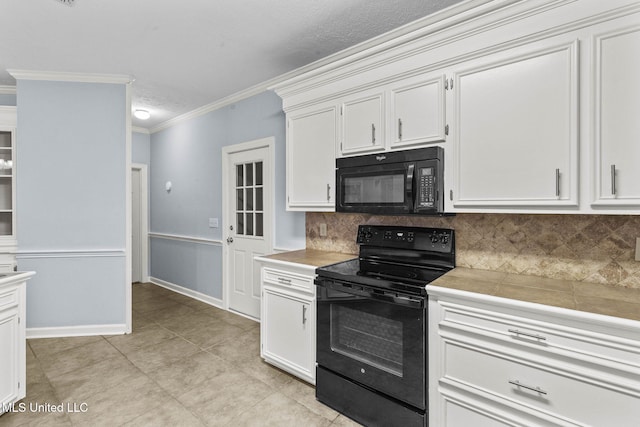 kitchen featuring black appliances, decorative backsplash, ornamental molding, light tile patterned floors, and white cabinetry