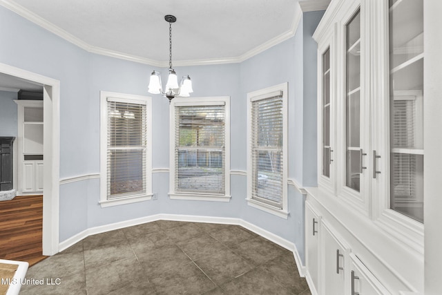 unfurnished dining area with a chandelier, dark hardwood / wood-style floors, and ornamental molding