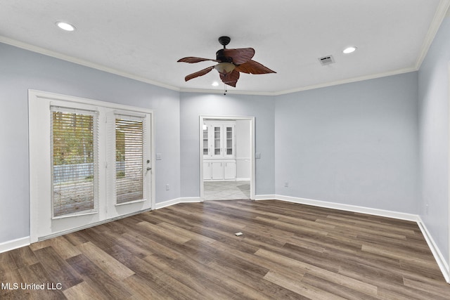 empty room with ceiling fan, wood-type flooring, and ornamental molding