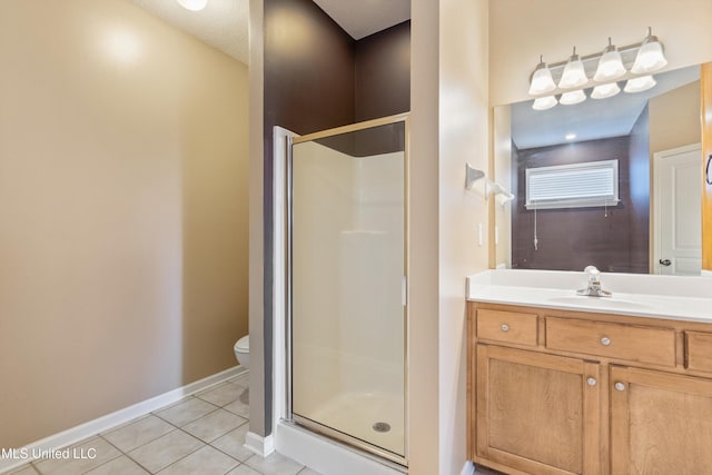 bathroom with toilet, tile patterned flooring, a shower with door, and vanity