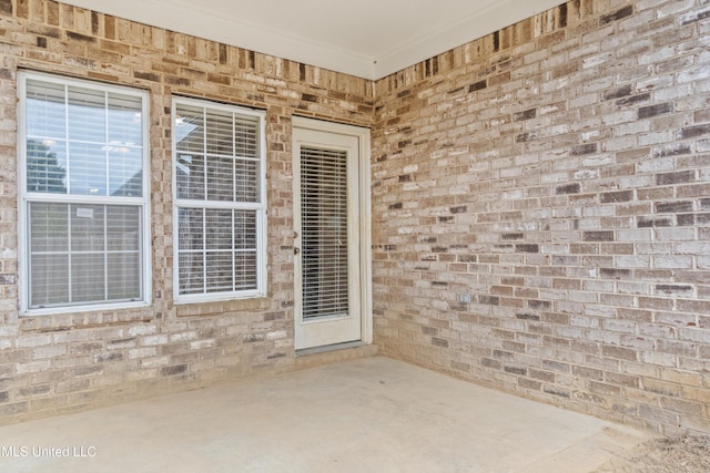 entrance to property with a patio