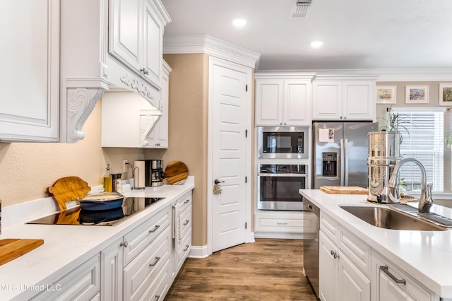 127 Grande View Dr, Biloxi, MS 39531 - kitchen featuring white cabinetry, visible vents, a sink, and stainless steel appliances