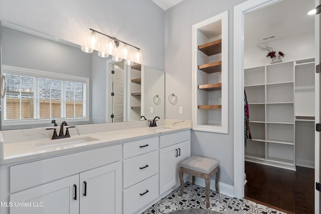 bathroom featuring hardwood / wood-style floors and vanity