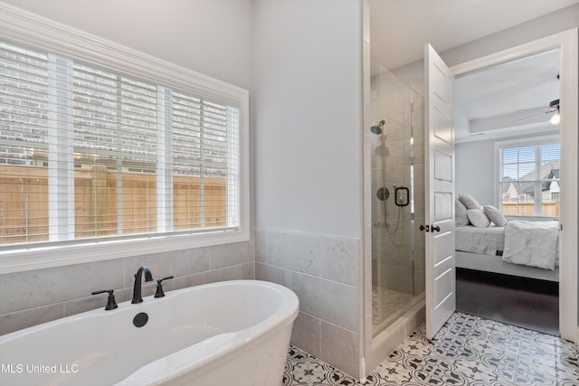 bathroom with tile patterned flooring, ceiling fan, and independent shower and bath