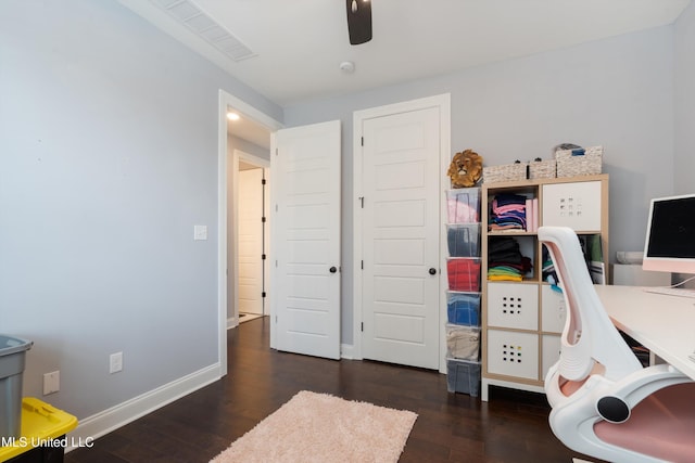 office area with ceiling fan and dark wood-type flooring