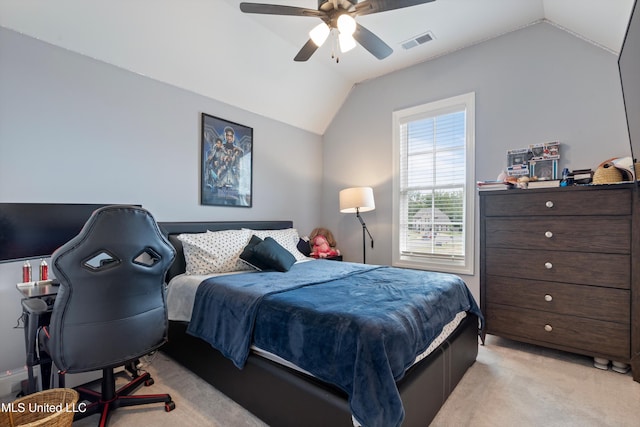 carpeted bedroom featuring vaulted ceiling and ceiling fan