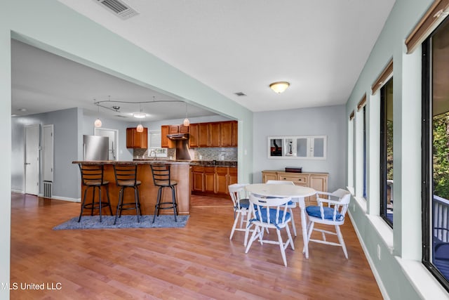 2529 Windward Dr, Gautier, MS 39553 - dining room with light wood finished floors and baseboards