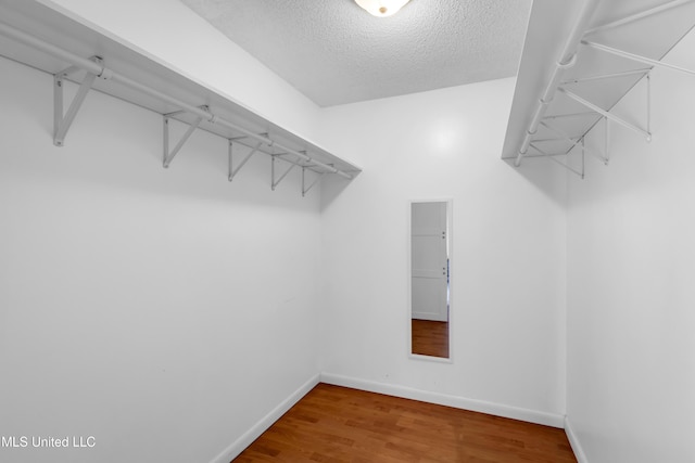 2529 Windward Dr, Gautier, MS 39553 - spacious closet with wood finished floors