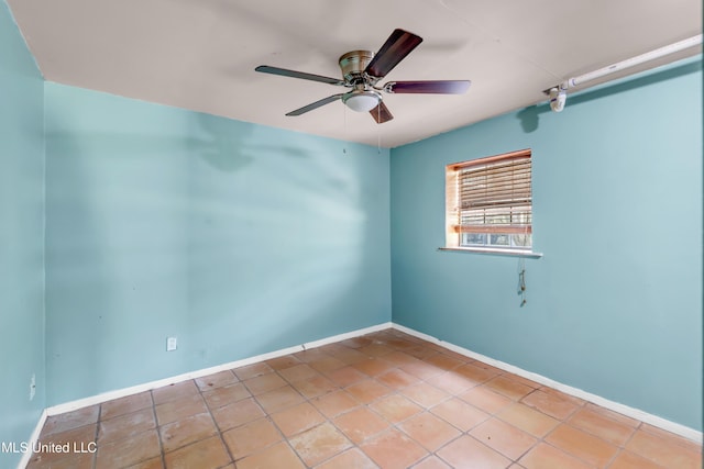 2529 Windward Dr, Gautier, MS 39553 - empty room featuring ceiling fan, tile patterned flooring, and baseboards