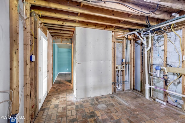 2529 Windward Dr, Gautier, MS 39553 - unfinished basement with brick patterned flooring