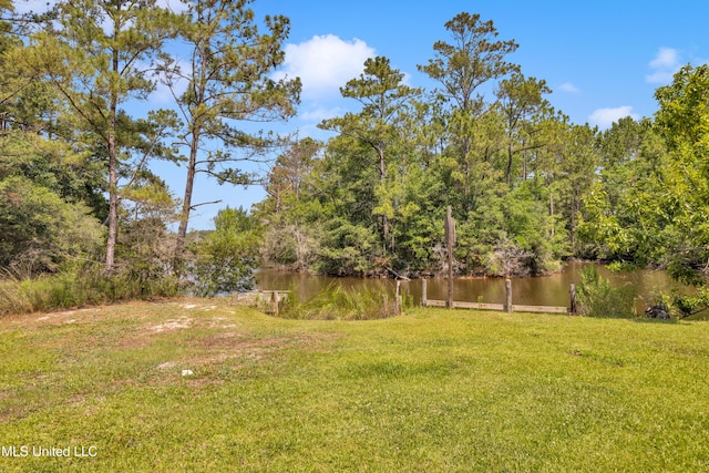 2529 Windward Dr, Gautier, MS 39553 - view of green lawn featuring a water view and a view of trees