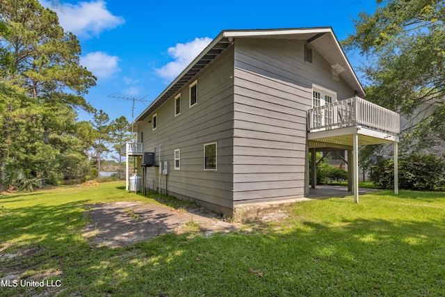 2529 Windward Dr, Gautier, MS 39553 - view of property exterior with a yard, a wooden deck, and central air condition unit