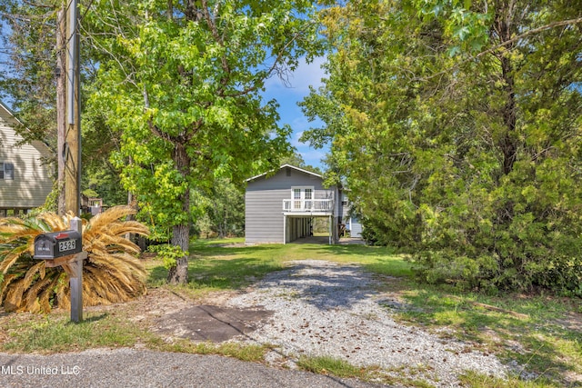 2529 Windward Dr, Gautier, MS 39553 - view of front of property featuring dirt driveway, stairway, and a carport