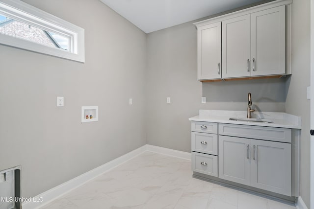 2115 Livingston Way, Hernando, MS 38632 - washroom with washer hookup, cabinet space, light marble finish floors, and baseboards