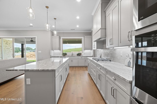 2115 Livingston Way, Hernando, MS 38632 - kitchen with ornamental molding, appliances with stainless steel finishes, a sink, decorative backsplash, and recessed lighting