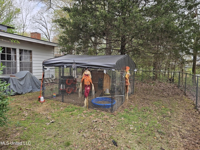 view of poultry coop featuring fence