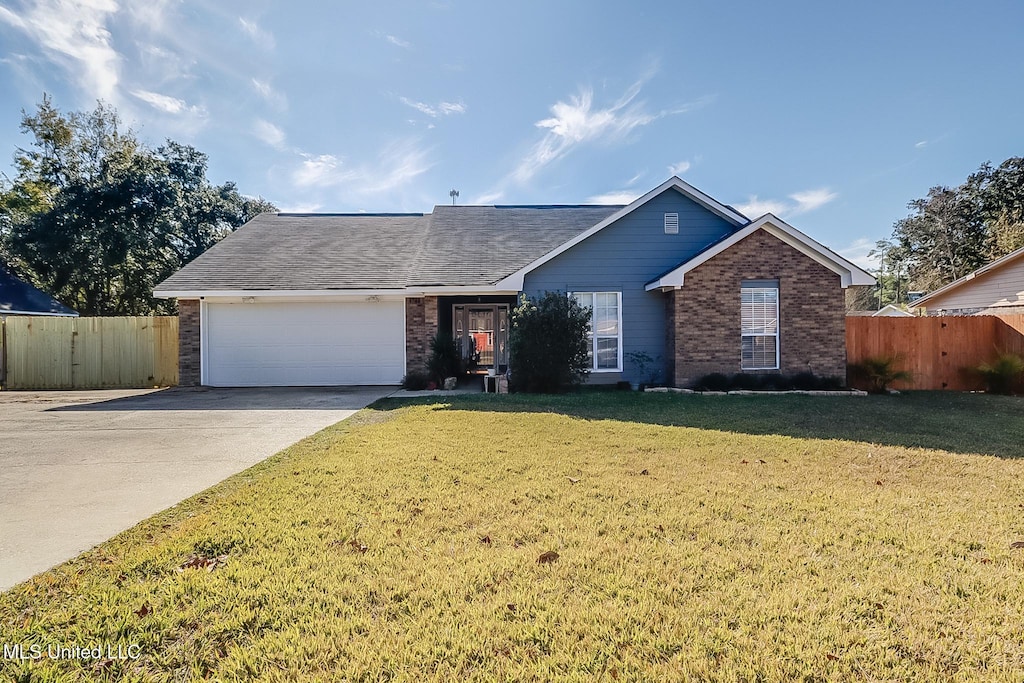 6805 Oakhurst Dr, Ocean Springs, MS 39564 - ranch-style home featuring a front yard and a garage