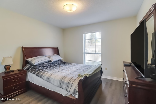 bedroom featuring dark hardwood / wood-style floors