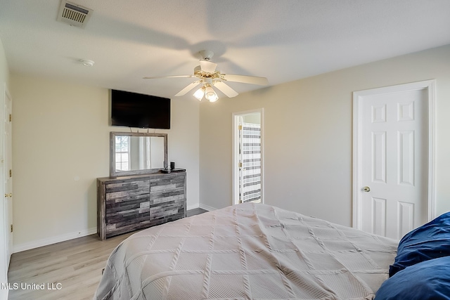 bedroom featuring ceiling fan and light hardwood / wood-style flooring