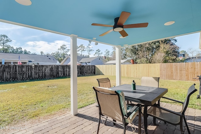 deck with ceiling fan and a lawn