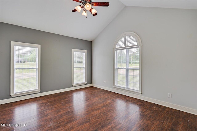 empty room featuring dark wood finished floors, ceiling fan, baseboards, and high vaulted ceiling