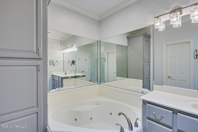 bathroom featuring two vanities, crown molding, a tub with jets, and a sink