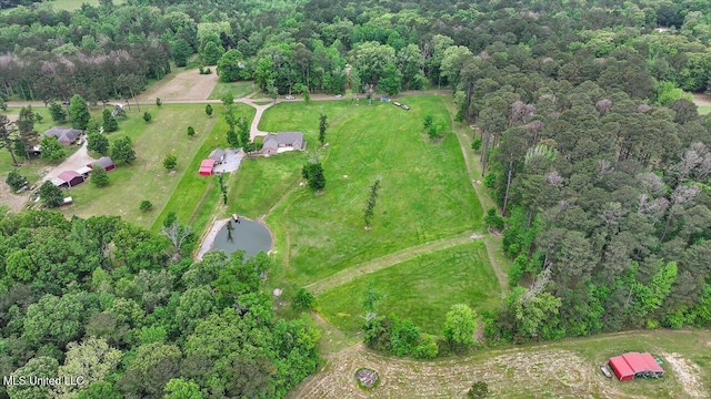 bird's eye view featuring a wooded view