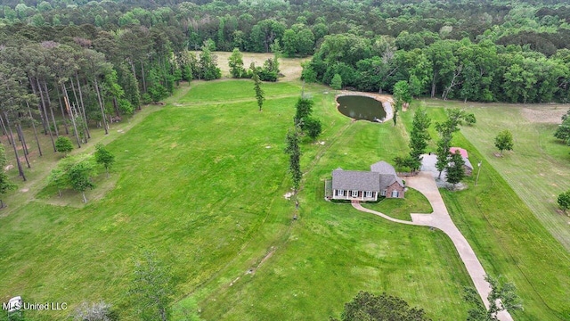drone / aerial view featuring a view of trees