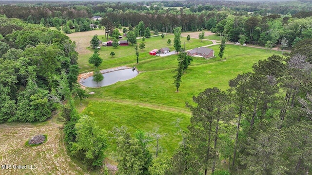 aerial view with a forest view and a water view