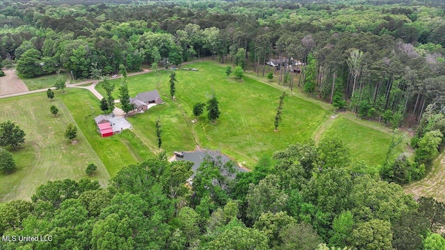 bird's eye view with a rural view and a wooded view