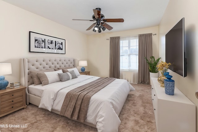 bedroom with light carpet and ceiling fan