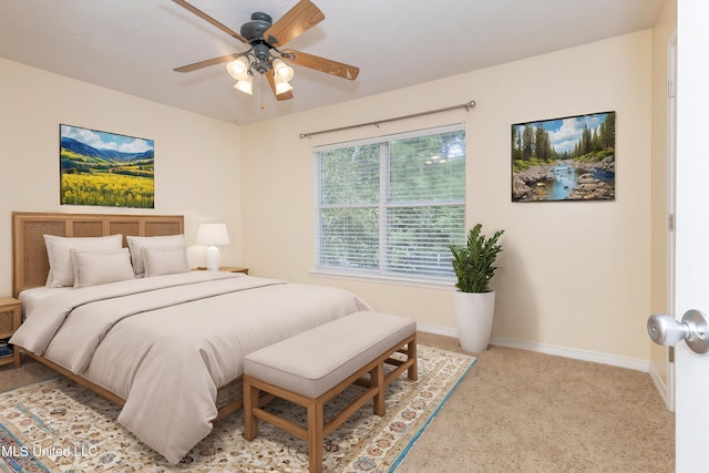 bedroom featuring ceiling fan and light colored carpet