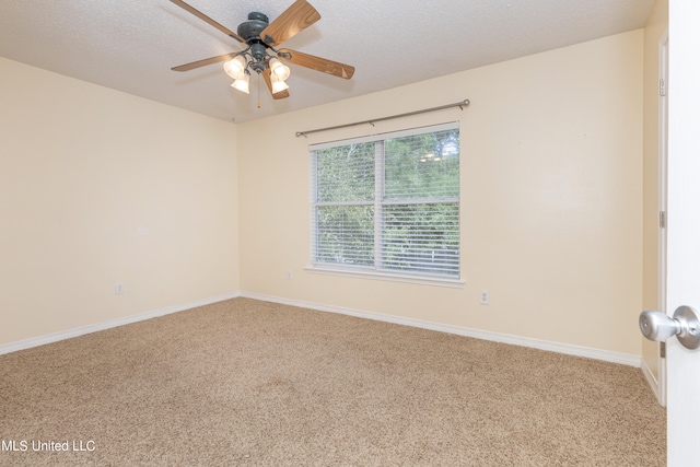 unfurnished room featuring ceiling fan, a textured ceiling, and carpet flooring