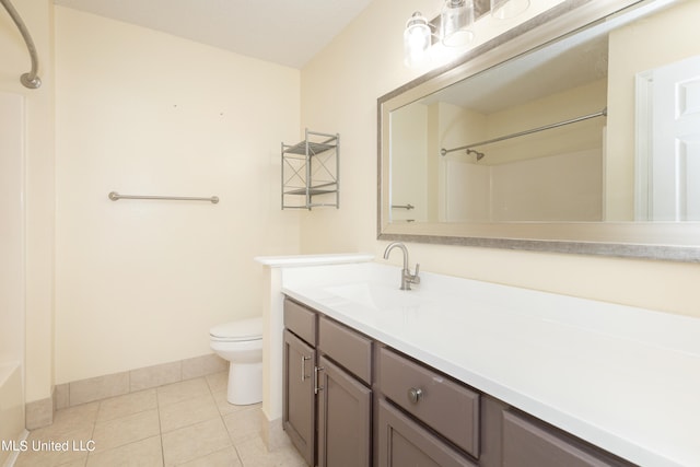 full bathroom with toilet,  shower combination, vanity, and tile patterned floors