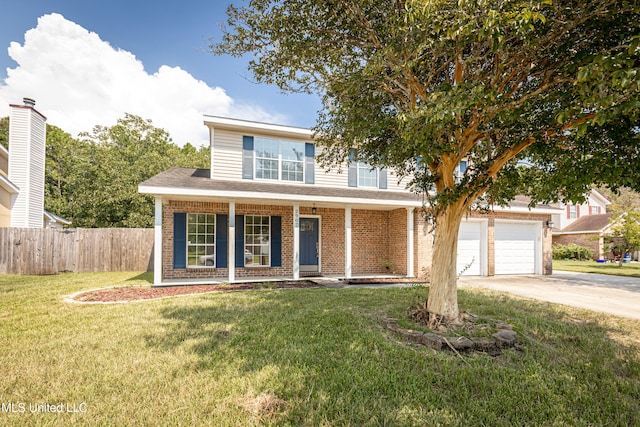 view of front of house featuring a front yard, a porch, and a garage