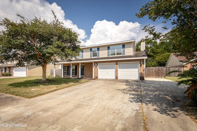 view of front property with a front lawn and a garage