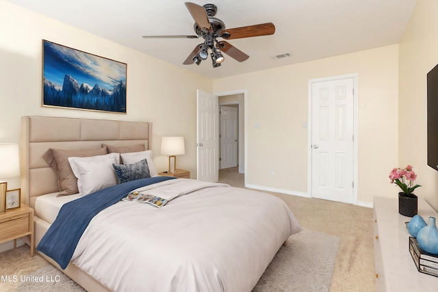 bedroom with light carpet and ceiling fan