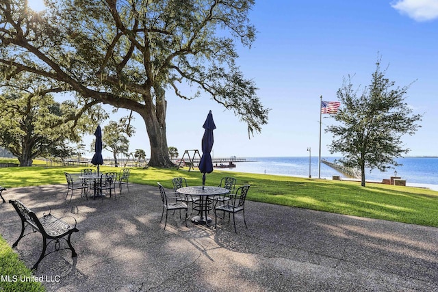 527 Front Beach Dr Unit 17, Ocean Springs, MS 39564 - view of patio / terrace with outdoor dining space and a water view