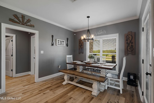 446 Newman Camp Rd, Sumrall, MS 39482 - dining room with baseboards, a chandelier, crown molding, and light wood-type flooring