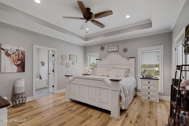 446 Newman Camp Rd, Sumrall, MS 39482 - bedroom featuring light wood-style flooring, multiple windows, a tray ceiling, ornamental molding, and recessed lighting