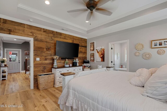 446 Newman Camp Rd, Sumrall, MS 39482 - bedroom with light wood-style flooring, wooden walls, ornamental molding, recessed lighting, and a raised ceiling