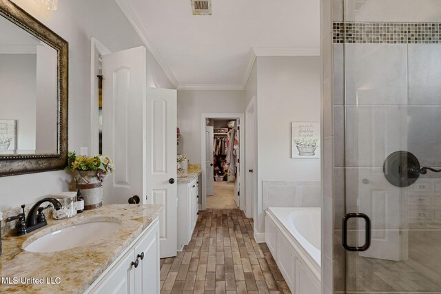 446 Newman Camp Rd, Sumrall, MS 39482 - full bath with a shower stall, vanity, ornamental molding, a garden tub, and a walk in closet