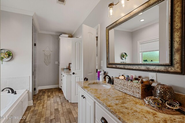 446 Newman Camp Rd, Sumrall, MS 39482 - bathroom with two vanities, crown molding, a bath, a shower stall, and wood finished floors