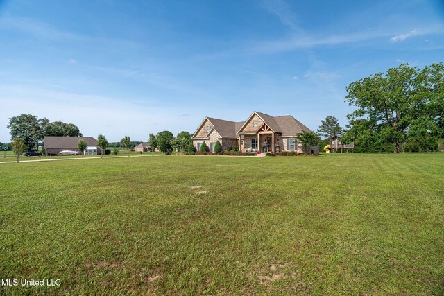 446 Newman Camp Rd, Sumrall, MS 39482 - view of front facade with a front yard and stone siding
