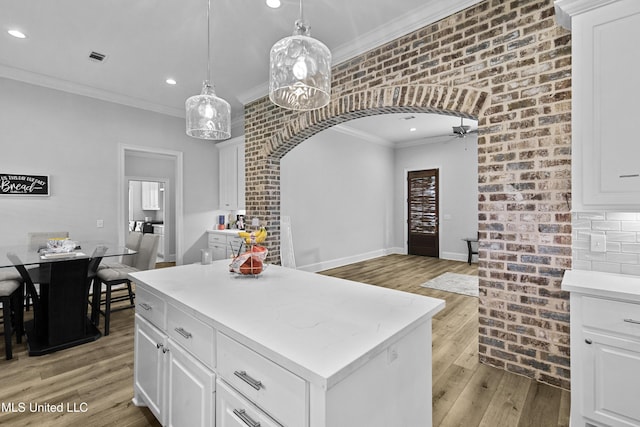 962 Glenwild Cir, Canton, MS 39046 - kitchen with crown molding, ceiling fan, light wood finished floors, recessed lighting, and light countertops