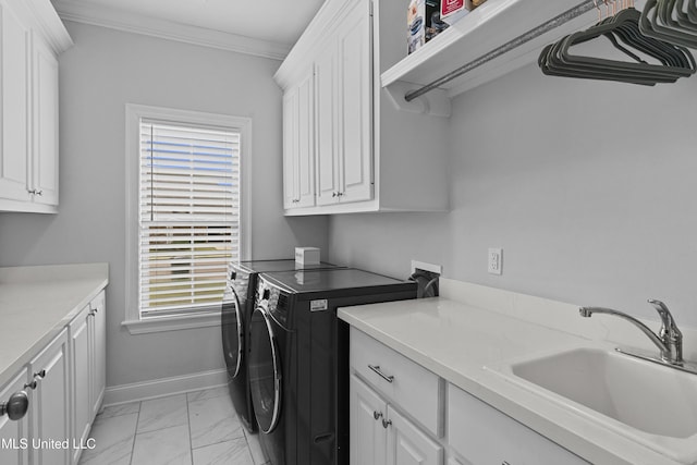 962 Glenwild Cir, Canton, MS 39046 - laundry area with washer and clothes dryer, cabinet space, light marble finish floors, baseboards, and ornamental molding
