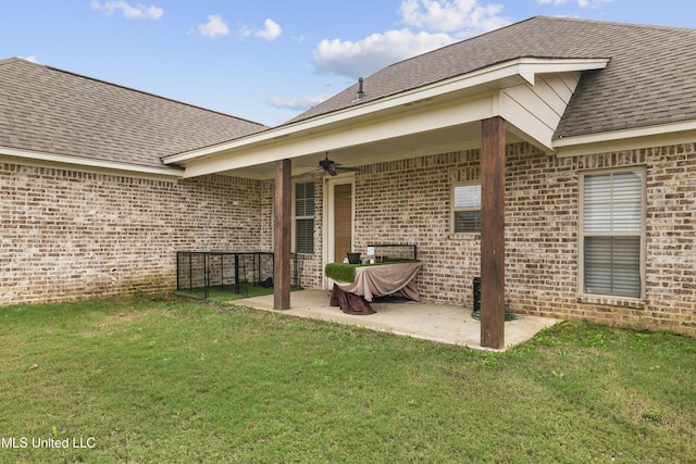 962 Glenwild Cir, Canton, MS 39046 - rear view of property with ceiling fan, a patio area, brick siding, and a yard
