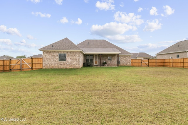 962 Glenwild Cir, Canton, MS 39046 - rear view of house with brick siding and a shingled roof
